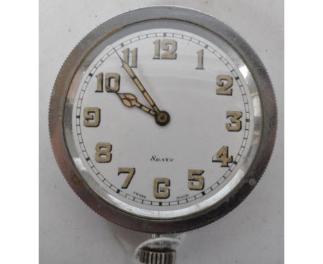 A 1920s white metal car clock pocket watch. The watch having a white face with arabic numerals to the chapter ring and crown 