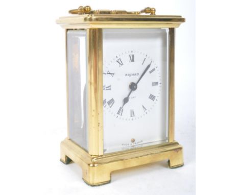 A vintage 20th century French Bayard brass carriage clock. The clock having Arabic numeral to the chapter ring with swan neck