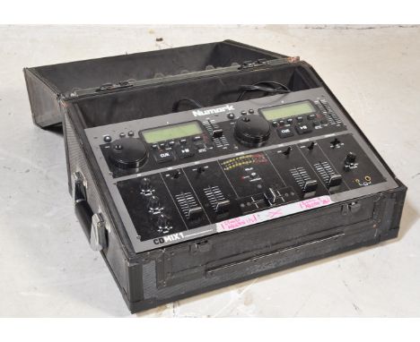 A vintage Numark CDMIX1 Professional CD Mixing Console DJ deck. Held within carry case. Measures&nbsp;