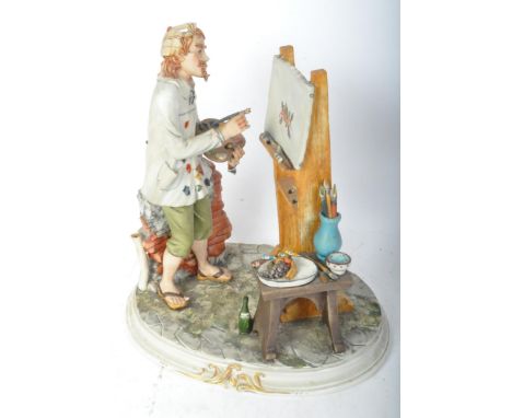 A vintage 20th century Capodimonte porcelain figurine of the artist having a man standing in front of an easel raised on a ci