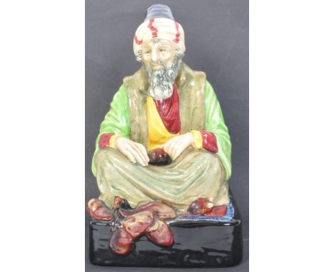 A 20th century ceramic Royal Doulton figurine - The Cobbler / Chu Chin Chau - Eastern Delights -&nbsp; HN1283. Signed by Noke