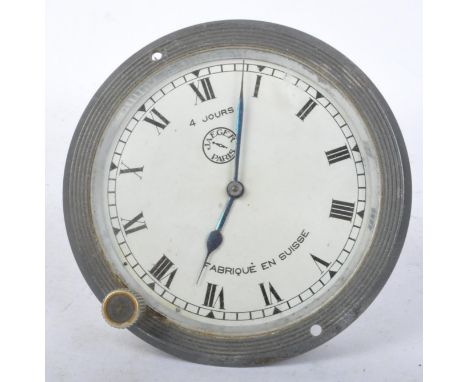 A 1920's Art Deco Jaeger Paris Fabrique En Suisse car clock. The clock having a round dial with roman numerals to the chapter