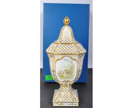 A 20th century Royal Worcester Royal&nbsp; fine bone china lidded vase urn having hand painted faunistic decorations of hunte