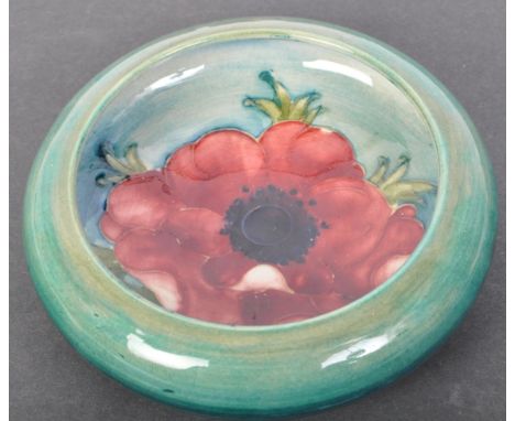 A vintage 20th century Moorcroft turquoise ground pin dish in the "Anemone" pattern. Green impressed Moorcroft marks to base.