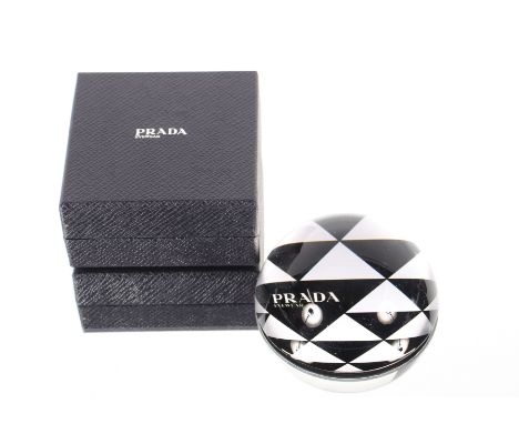 A Prada paperweight in original box, 8cm dia. 
