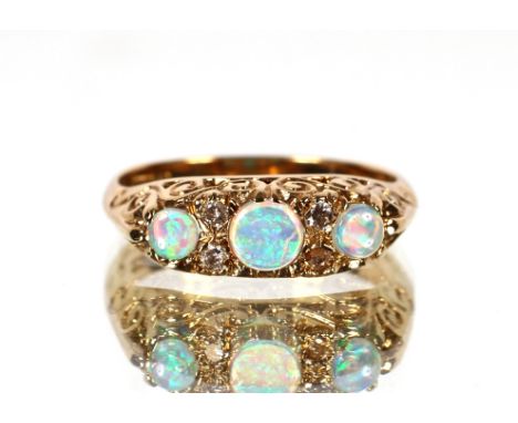 A 9ct gold opal and diamond set ring,&nbsp;ring size P.&nbsp;Approx. 3.3g