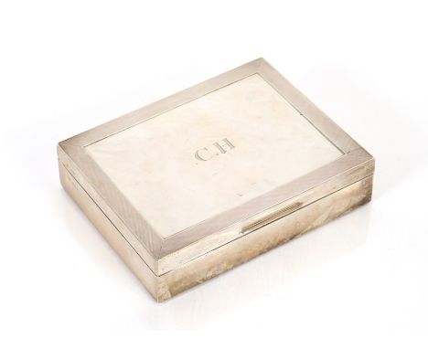 A silver cigarette case, the engine turned banded top initial "C.H. London 1939", 17cm wide&nbsp;
