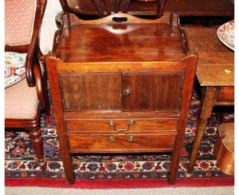 A 19th Century mahogany night commode, having tray top, drawer and cupboard below, raised on square section supports 58cm wid