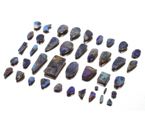 A quantity of polished opal doublet stones
