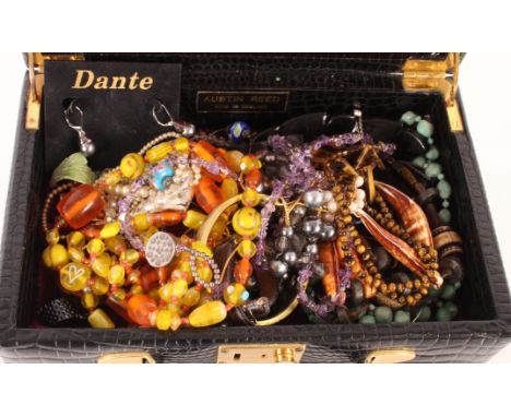 A silver snap bangle; various coloured beads and miscellaneous costume jewellery and coins contained in two jewellery boxes 