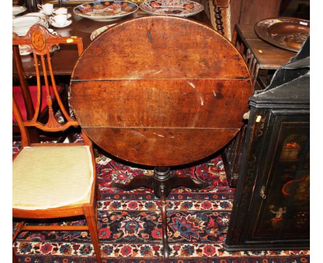 A 19th Century oak tripod tea table having bird cage action raised on turned baluster column and tripod base, AF