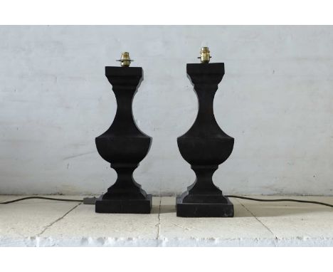 A pair of large wooden table lamps, of recent manufacture, each square baluster lamp with an ebonised finish,17cm wide17cm de