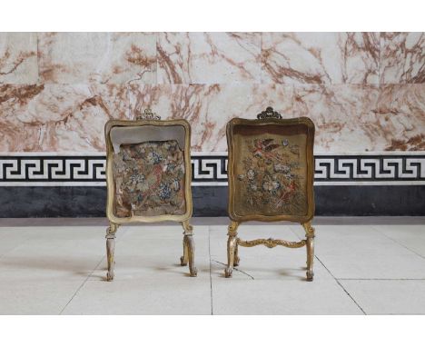 A pair of carved and giltwood fire screens, each with a shaped rectangular frame inset with a sliding tapestry panel, a pierc