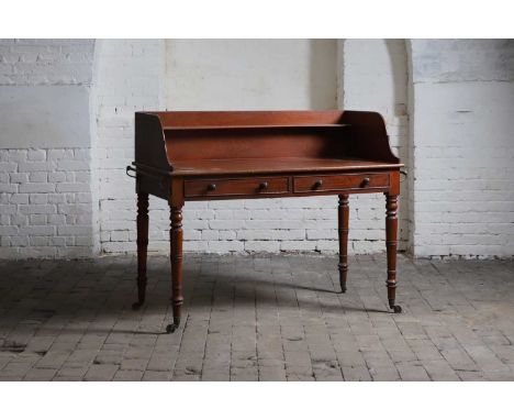 A mahogany washstand, late 19th century, with a high three-quarter gallery fitted with a single shelf, over two drawers with 