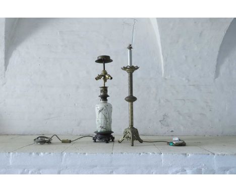 Two Victorian table lamps, comprising a pottery example, converted from an oil lamp, decorated with finches and insects and w