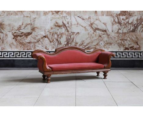 A Victorian mahogany sofa, mid-19th century, with show frame and red upholstery, raised on short turned legs,200cm wide61cm d
