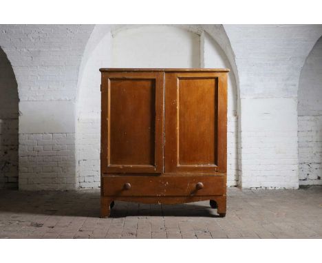 A scumbled pine estate cabinet, 19th century, the hinged quarter-depth top over a pair of cupboards, enclosing a single shelf