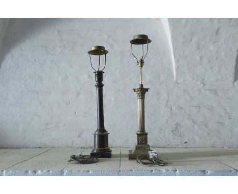 A gilt-brass table lamp, 20th century, in the form of a reeded column with Corinthian capital and raised on a stepped plinth,