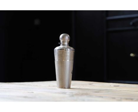 A Victorian silver engine-turned tapering flask, by E H Stockwell, London 1859,with a detachable beaker cup, engraved with 'I