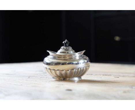 An Edwardian silver bachelor's tea caddy, by Charles Adams and George Adams, London 1906,with a half-gadrooned body and a hin