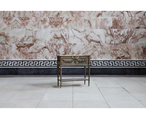 A giltwood trough planter, the caned front panel centred with a winged cherub and floral swags, raised on fluted tapering sup