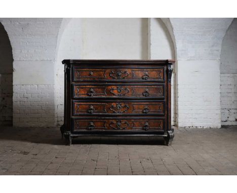 A walnut commode, c.1700, Italian, Lombardy, the serpentine front with four long drawers with ebonised mouldings, each fitted