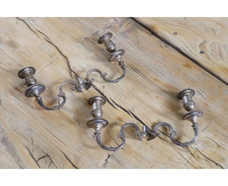 Two pairs of Victorian two-light silver candelabra branches, by Hawksworth Eyre &amp; Co., Sheffield 1875,each with a central