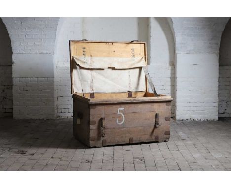 A large iron-bound trunk, 20th century, inscribed '5' on the hinged cover, sides and front, enclosing a partially canvas line