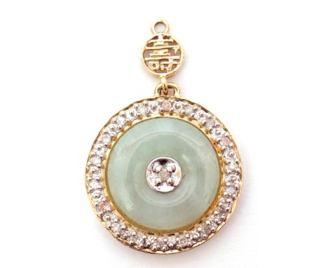 Modern jade and diamond set pendant, the circular shaped jade panel centering a small diamond in a yellow metal diamond set m