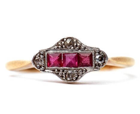 Ruby and diamond ring, the centre featuring a line of three calibre cut rubies, framed in a diamond and illusion setting, sta