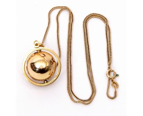 A 750 stamped globe pendant, the globe rotates on an axis of plain polished design, suspended from a 750 stamped woven chain,