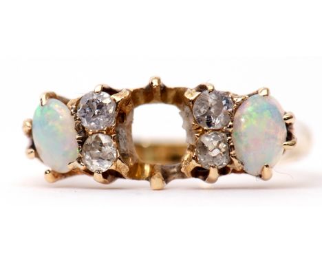 Opal and diamond ring (centre stone missing), featuring two oval opal cabochons highlighted with 4 small diamonds, stamped 18