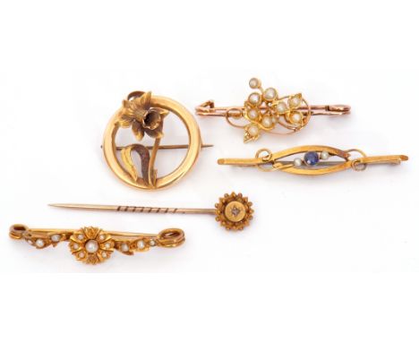 Mixed Lot: 15ct stamped openwork floral brooch, an 18ct stamped seed pearl set floral brooch, a 15ct and diamond stick pin, t