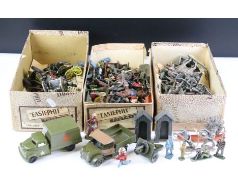 Large collection of metal figures, vehicles and accessories to include Wild West and various military examples, showing play 