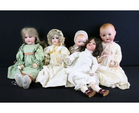 Five early 20th C Armand Marseille bisque headed dolls with glass eyes, jointed composition limbs &amp; painted facial featur