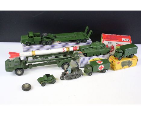 Three boxed Dinky military diecast models to include 660 Tank Transporter, 651 Centurion Tank and 623 Army Covered Wagon plus
