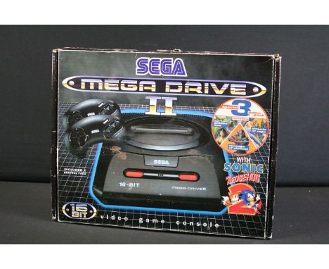 Retro Gaming - A boxed Sega Mega Drive II 16-Bit games console with two controllers, manual, power supply and 2 x cased game 