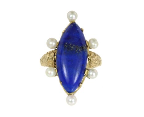 A LAPIS LAZULI AND PEARL DRESS RING set with a large marquise cabochon lapis lazuli surrounded by a border of six pearls to a