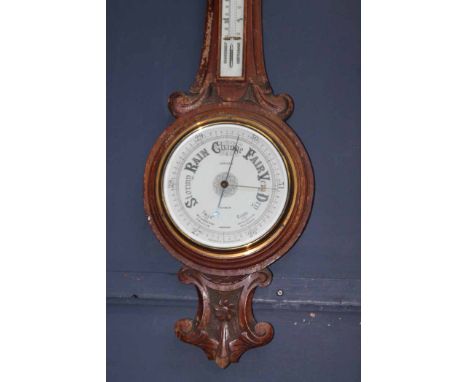 VICTORIAN CARVED OAK BANJO BAROMETER
approximately 91cm long; together with a stick barometer mounted on an oak frame, serial