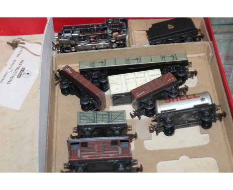 TRIX TWIN TRAIN SET
in original box; together with a box of extra carriages, props and tracks, etc (2)