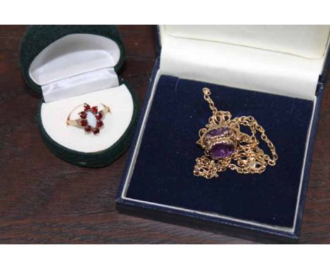 OPAL AND GARNET SET DRESS RING 
set in 9ct gold; together with an amethyst set fob on a gold chain, set in 14ct gold (2)