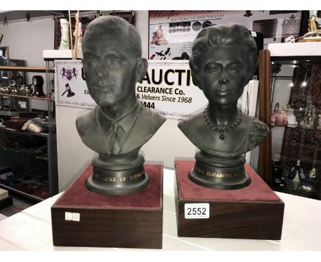 A pair of Royal Doulton busts of Elizabeth II and Prince Philip commemorating their Silver Wedding Anniversary, both marked m
