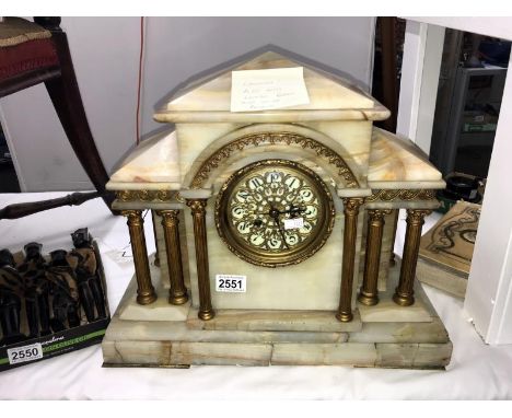 An onyx and brass mantel clock (a/f loose brass and onyx panels)