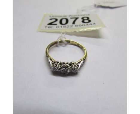 An 18ct gold and platinum 3 stone diamond ring, size M. (with 1984 valuation of £185).