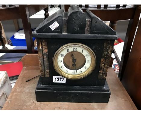 A slat mantel clock for restoration
