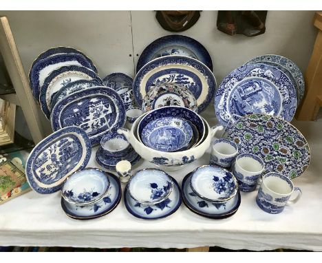 A quantity of blue and white pottery including Spode blue willow etc.