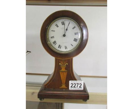 A good Edwardian mahogany inlaid mantel clock, in working order.