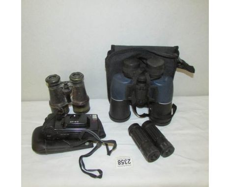 3 pairs of binoculars and a camera.