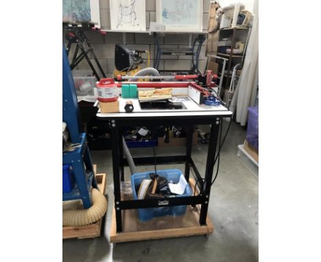 A Jessem Rout-R-Lift router table with fitted Freud 1900W router