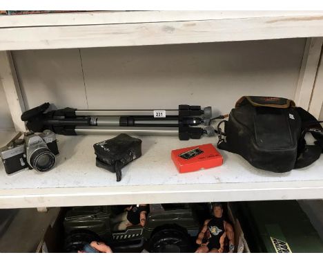 A Canon and Minolta cameras, tripod and a boxed pair of pocket binoculars